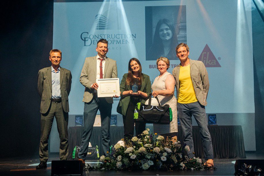 Team on stage winning an award