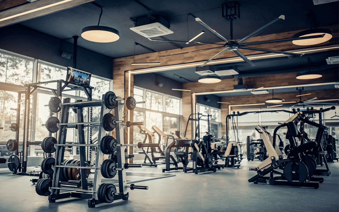 A modern gym with weights, exercise machines and air conditioning